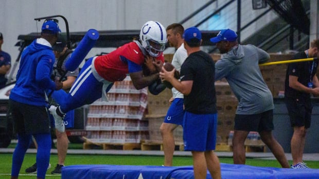 Indianapolis Colts quarterback Anthony Richardson (5) takes a leap Friday, July 28, 2023, during an indoor practice at Grand Park Sports Campus in Westfield, Indiana.